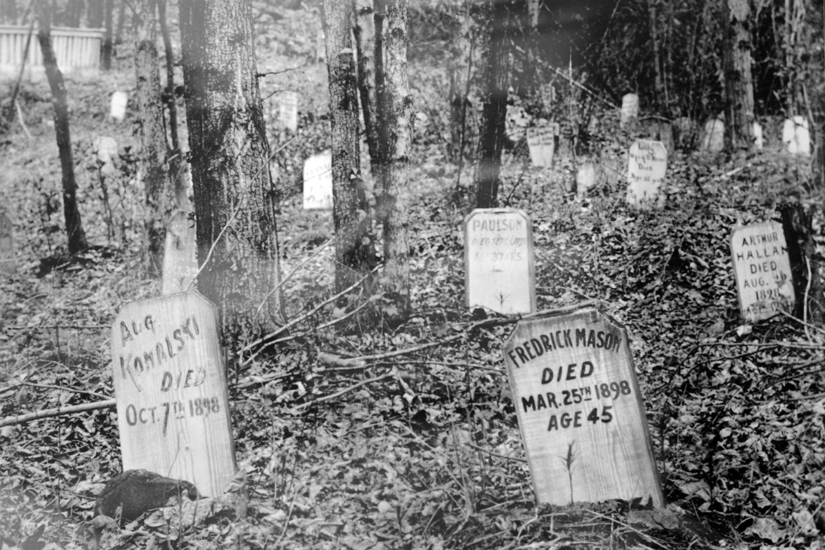 23B Photo of Graves From 1898 In The Window Of Lowes Mortuary In Dawson City Yukon